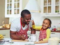 father cooking with daughter